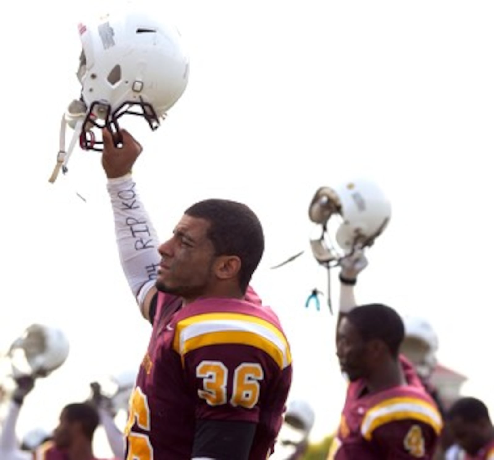 Central State University football players raised their helmets in remembrance of their teammate Kordero Hunter during their game against the University of Dayton at McPherson Stadium in 2011, the first game to be played after Hunter's death. CONTRIBUTED PHOTO