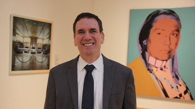 New chief curator Jerry Smith (second from left) is shown with (left to right) Dayton Art Institute director Michael Roediger, exhibition designer Martin Pleiss and assistant curator Katherine Ryckman Siegwarth. CONTRIBUTED