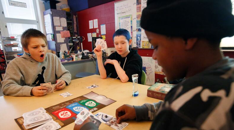 Dayton Public Schools Ruskin PreK-6 School offers Miracle Makers after schools programs for its students. Supported by East End Services, the curriculum is hands-on, project based learning with programs such as robotics and stringed instruments like the cello and violin. Students play games at the end of the school day, before their Miracle Makers program starts. TY GREENLEES / STAFF