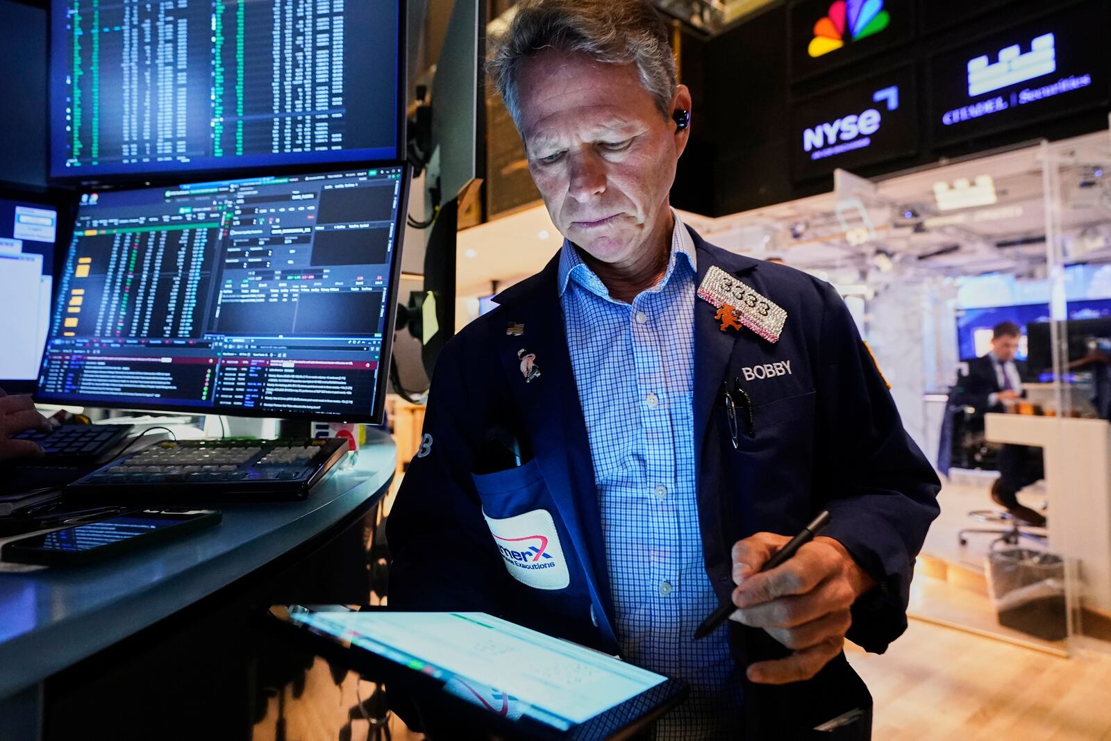 Trader Robert Charmak works on the floor of the New York Stock Exchange, Monday, June 9, 2025. (AP Photo/Richard Drew)