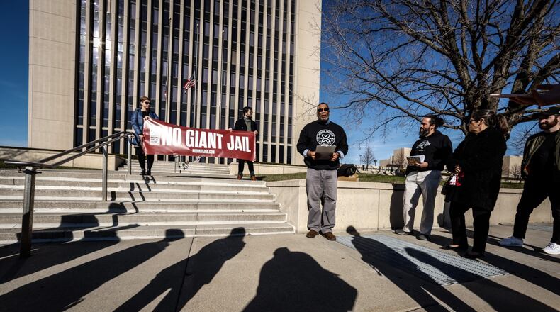 Edwin Fuller from the Montgomery County Jail Coalition speaks about the county possibly building a larger county jail on the steps of the County Administration Building on West Third St. Tuesday Dec. 14, 2021. The organization advocates for reducing the jail population and alternatives to incarceration. JIM NOELKER/STAFF