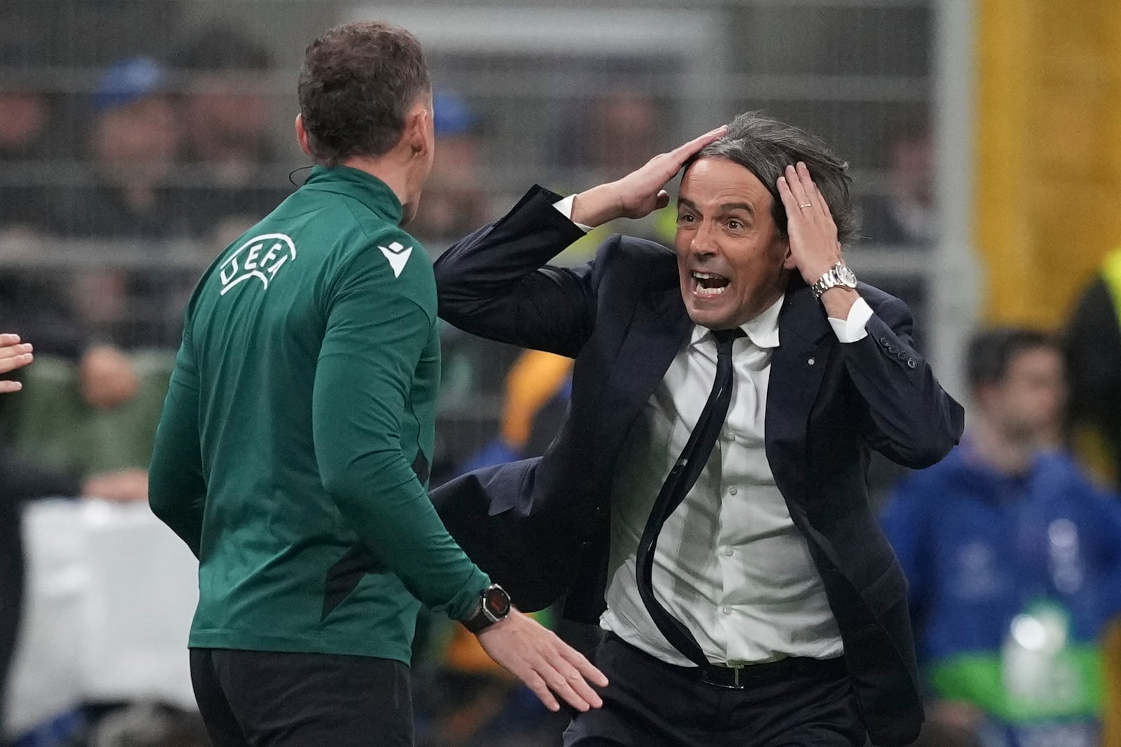 Inter Milan's head coach Simone Inzaghi shouts at UEFA official during the Champions League semifinal second leg soccer match between Inter Milan and Barcelona at San Siro stadium in Milan , Italy, Tuesday, May 6, 2025. (AP Photo/Antonio Calanni)