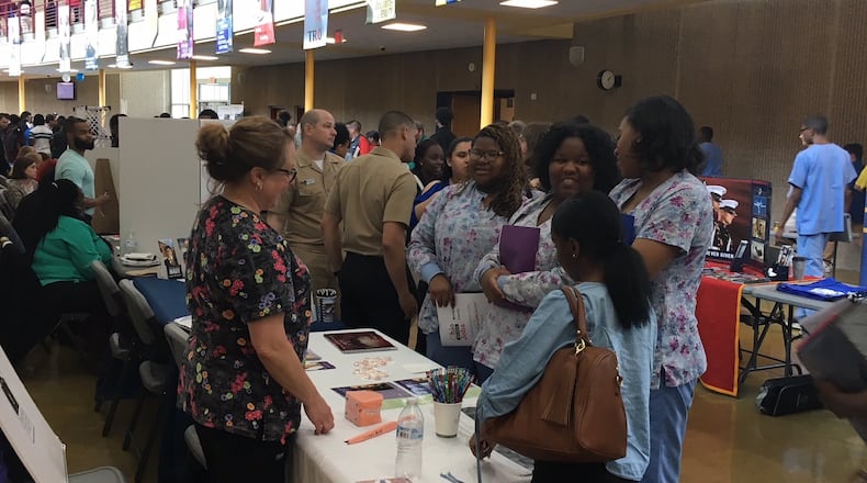 Ponitz Career Tech Center students who are certified as dental assistants meet with potential employers at a school job fair in 2019. JEREMY P. KELLEY / STAFF
