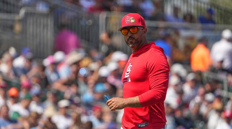 St. Louis Cardinals manager Oliver Marmol walks back from the mound after making a pitching change during the second inning of a spring training baseball game against the New York Mets Friday, Feb. 27, 2026, in Jupiter, Fla. (AP Photo/Jeff Roberson)