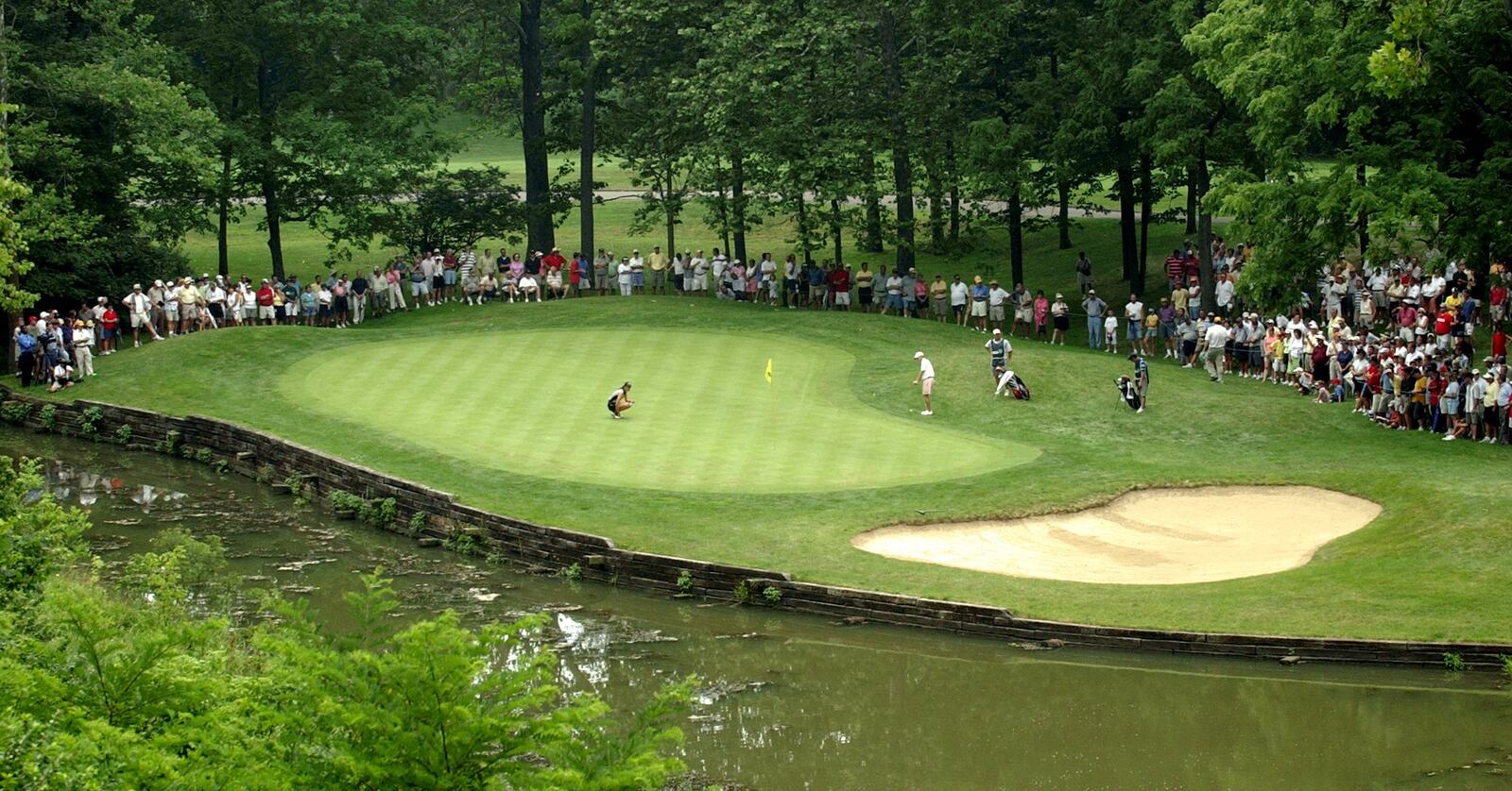 Michelle Wie lines up for a putt on the fifth green during the first qualifying round of the U.S. Amateur Public Links Championship at Shaker Run Golf Club in 2005. 