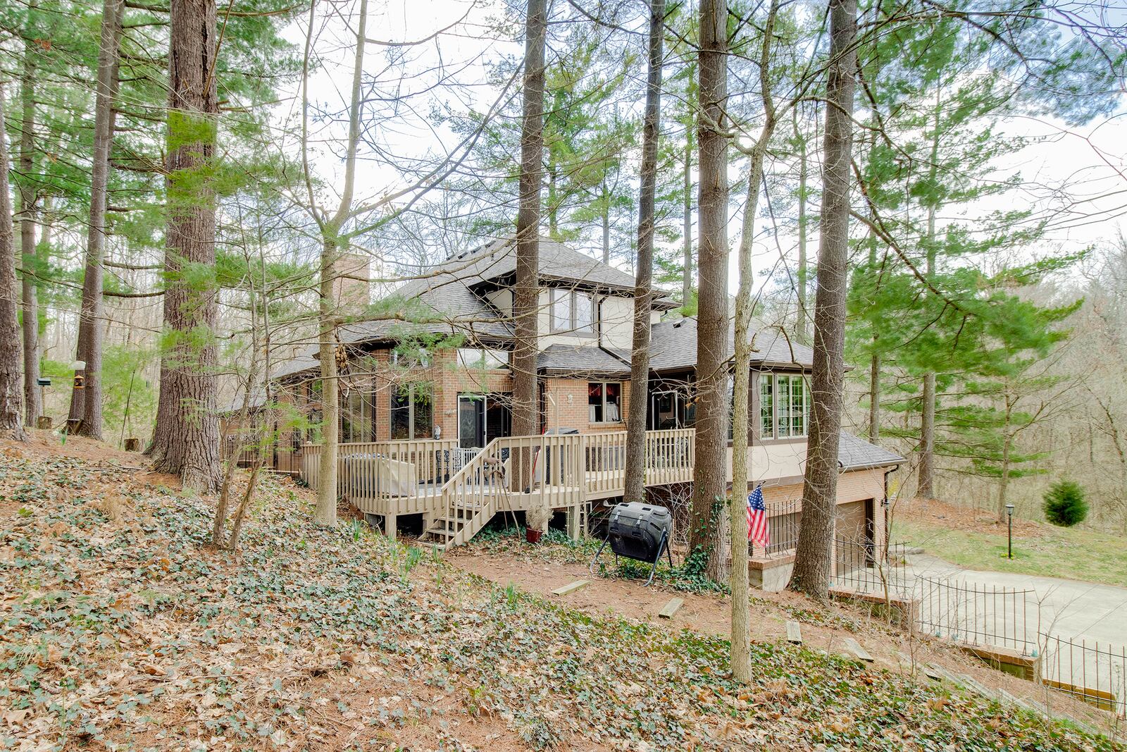 The home has a multi level system of wood decks that encircle the home and offer varying places to enjoy the wooded views.