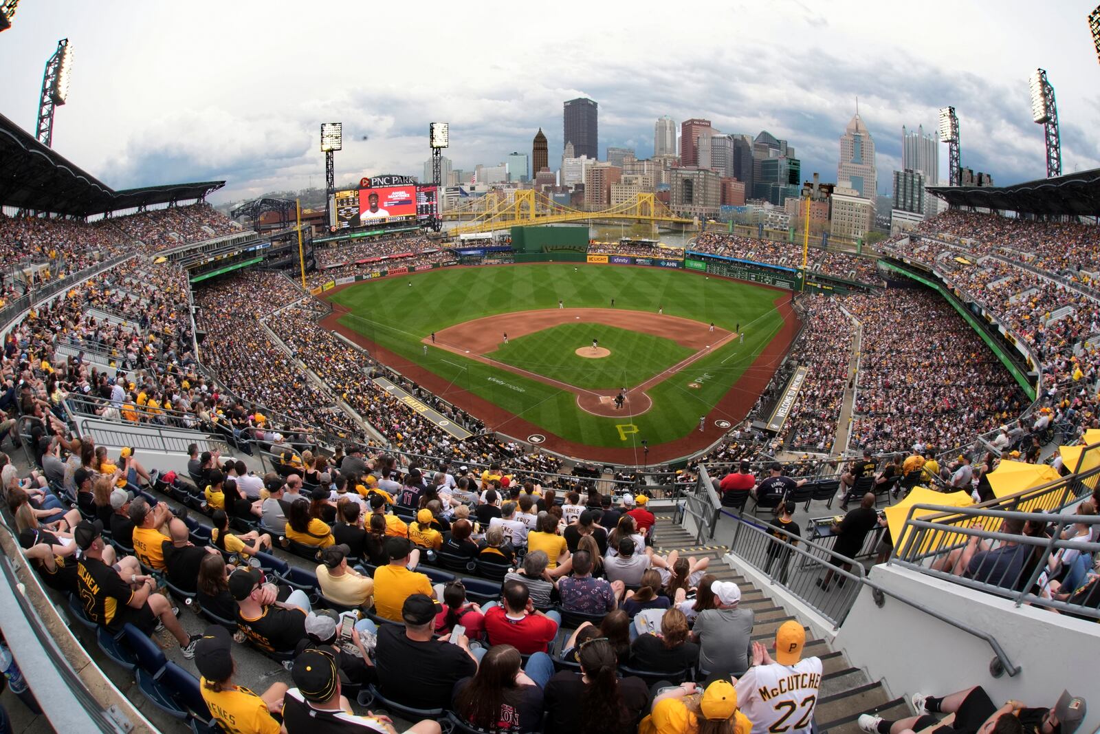 Fans watch a baseball game between the Pittsburgh Pirates and the Cleveland Guardians with Pirates' Paul Skenes pitching on Paul Skenes Bobblehead Day at PNC Park in Pittsburgh, Saturday, April 19, 2025. (AP Photo/Gene J. Puskar)