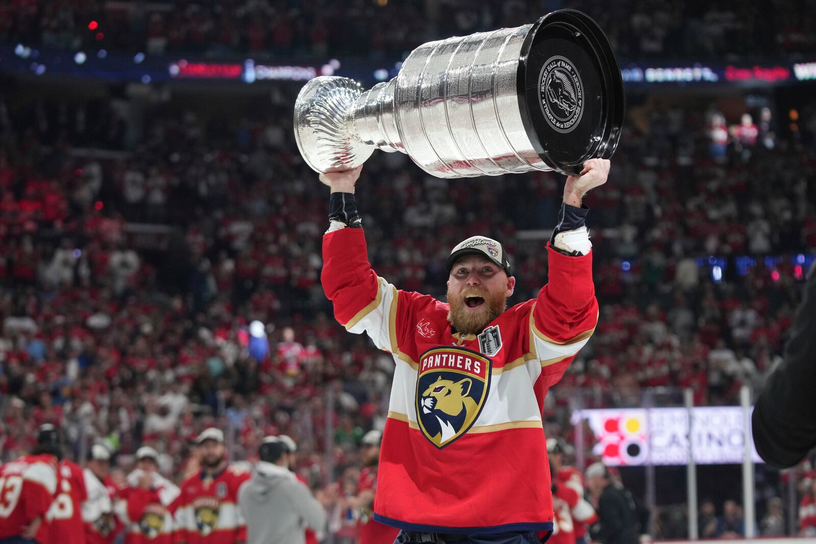 Florida Panthers center Sam Bennett lifts the Stanley Cup after defeating the Edmonton Oilers in Game 6 of the NHL hockey Stanley Cup Final Tuesday, June 17, 2025, in Sunrise, Fla. (AP Photo/Lynne Sladky)