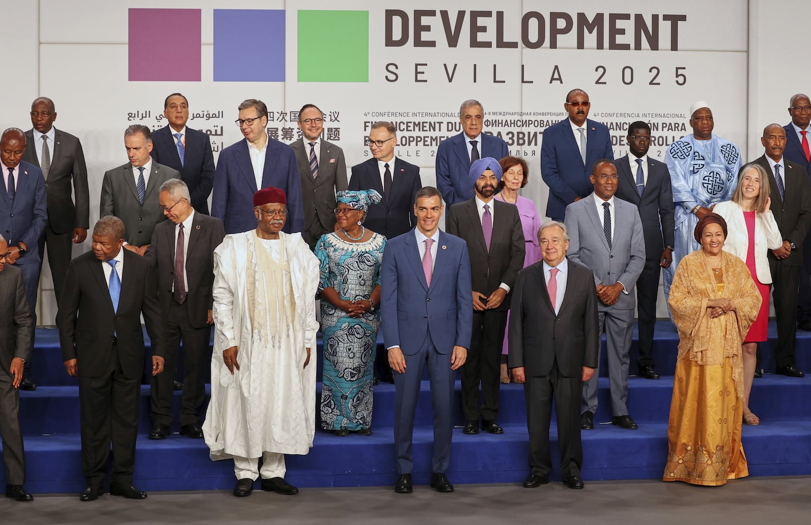 Spain's Prime Minister Pedro Sanchez, center, next to United Nations Secretary-General Antonio Guterres, pose for a photo with nation leaders and representatives, at the start of the four-day Financing for Development meeting, in Seville, Spain, Monday, June 30, 2025. (AP Photo/Jose Angel Garcia)