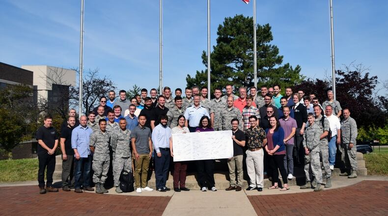 The Air Force Institute of Technology’s Center for Space Research and Assurance SkyPad team, composed of more than 60 students, military, and civilians, delivered a space-ready mission in less than six months and signatures from the team were laser etched into the baseplate of the Skypad payload. On Sunday, May 17, 2020, the USSF-7 mission successfully launched the Air Force Institute of Technology’s SkyPad, a payload aboard the United States Air Force Academy’s FalconSat-8 spacecraft bus, which is an experiment hosted on the X-37B Orbital Test Vehicle. (U.S. Air Force courtesy photo)