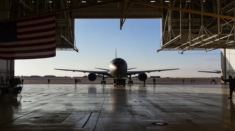 U.S. Airmen with the 22nd Aircraft Maintenance Squadron tow a new KC-46A Pegasus aircraft into Hangar 1126 at McConnell Air Force base, Kansas, Jan. 25, 2019. The KC-46 was displayed at center stage to allow guests a closer look inside the new aircraft. (U.S. Air Force photo by Airman 1st Class Alan Ricker)