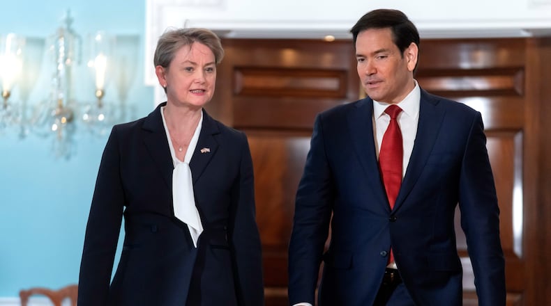 Secretary of State Marco Rubio, right, walks with Britain's Foreign Secretary Yvette Cooper at the State Department, Monday, Dec. 8, 2025, in Washington. (AP Photo/Mark Schiefelbein)