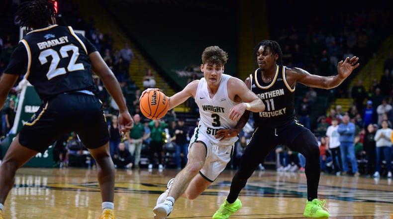 Wright State's Alex Huibregtse drives past Northern Kentucky's Randall Pettus II during a Horizon League quarterfinal at the Nutter Center on March 7, 2024. Joe Craven/Wright State Athletics