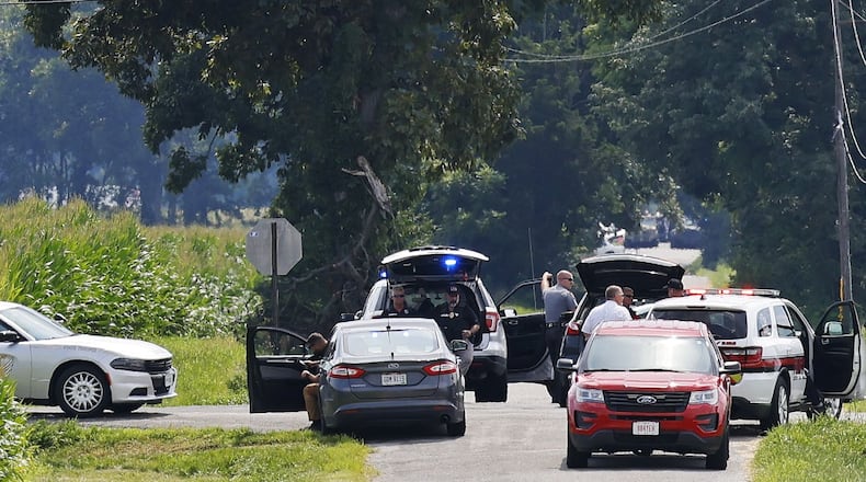 The area near Center and Smith roads was closed for hours during a standoff Thursday, Aug. 11, 2022, in Clinton County after an armed man tried to breach the FBI's Cincinnati office and fled north on Interstate 71. The unidentified suspect was shot and killed following a pursuit and standoff lasting roughly six hours. NICK GRAHAM/STAFF