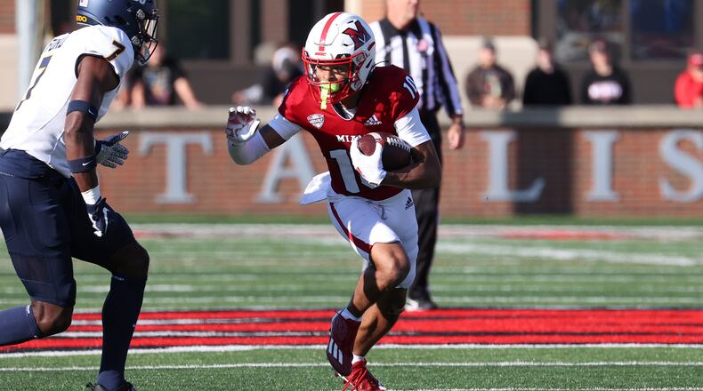 Miami's Gage Larvadain looks for room to run after a reception vs. Toledo at Yager Stadium on Oct. 21, 2023. Miami Athletics photo