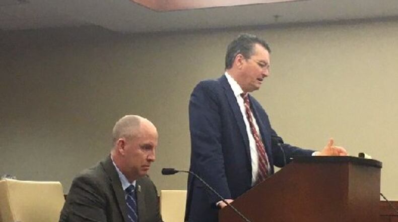 Defense attorney Patrick Mulligan (standing) gives closing statements Monday in a hearing to determine if his 17-year-old client should be tried as an adult in the shooting to death DoubleTree employee Jayren Graham of Miami Twp. Assistant Montgomery County Prosecutor John Amos looks on. NICK BLIZZARD/STAFF