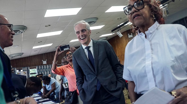 Veterans Affairs Secretary Denis McDonough, center, meets with attendees at a resource fair for veterans and survivors to apply for benefits under the PACT Act, Wednesday Aug. 2, 2023, in New York. Last year Congress delivered the Pact Act to expand VA healthcare and benefits for more than five million veterans and their families. (AP Photo/Bebeto Matthews)