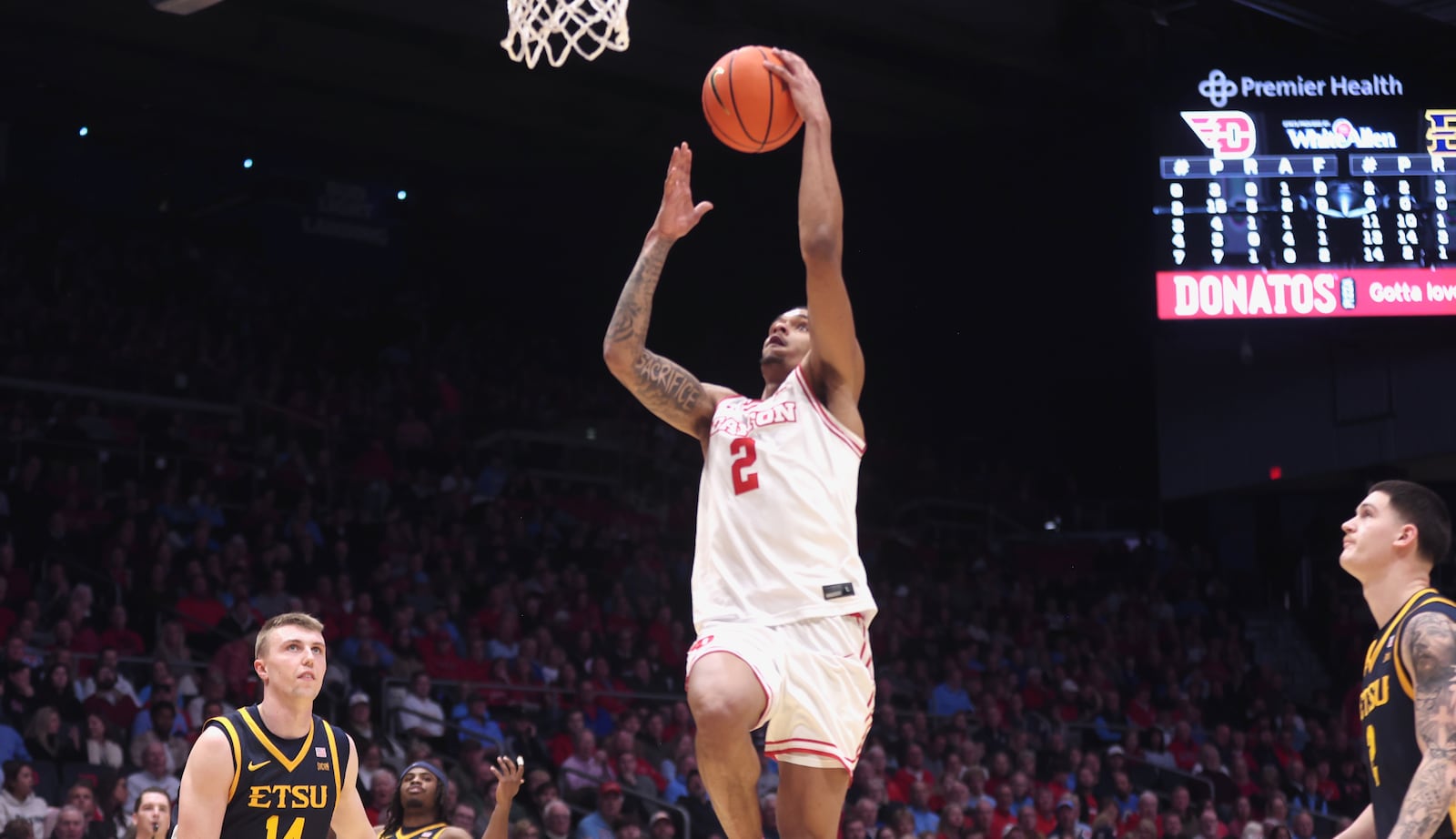 Dayton's De'Shayne Montgomery scores at the halftime buzzer against East Tennessee State on Tuesday, Dec. 2, 2025, at UD Arena. David Jablonski/Staff