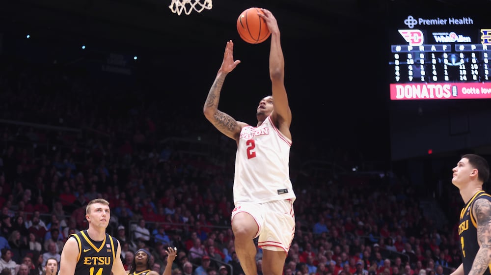 Dayton's De'Shayne Montgomery scores at the halftime buzzer against East Tennessee State on Tuesday, Dec. 2, 2025, at UD Arena. David Jablonski/Staff