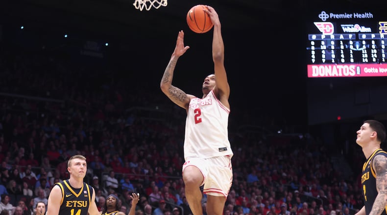 Dayton's De'Shayne Montgomery scores at the halftime buzzer against East Tennessee State on Tuesday, Dec. 2, 2025, at UD Arena. David Jablonski/Staff