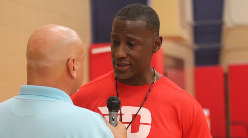 Dayton coach Anthony Grant talks to WHIO’s Larry Hansgen before an individual skill instruction workout on Thursday, Sept. 21, 2017, at the Cronin Center. David Jablonski/Staff