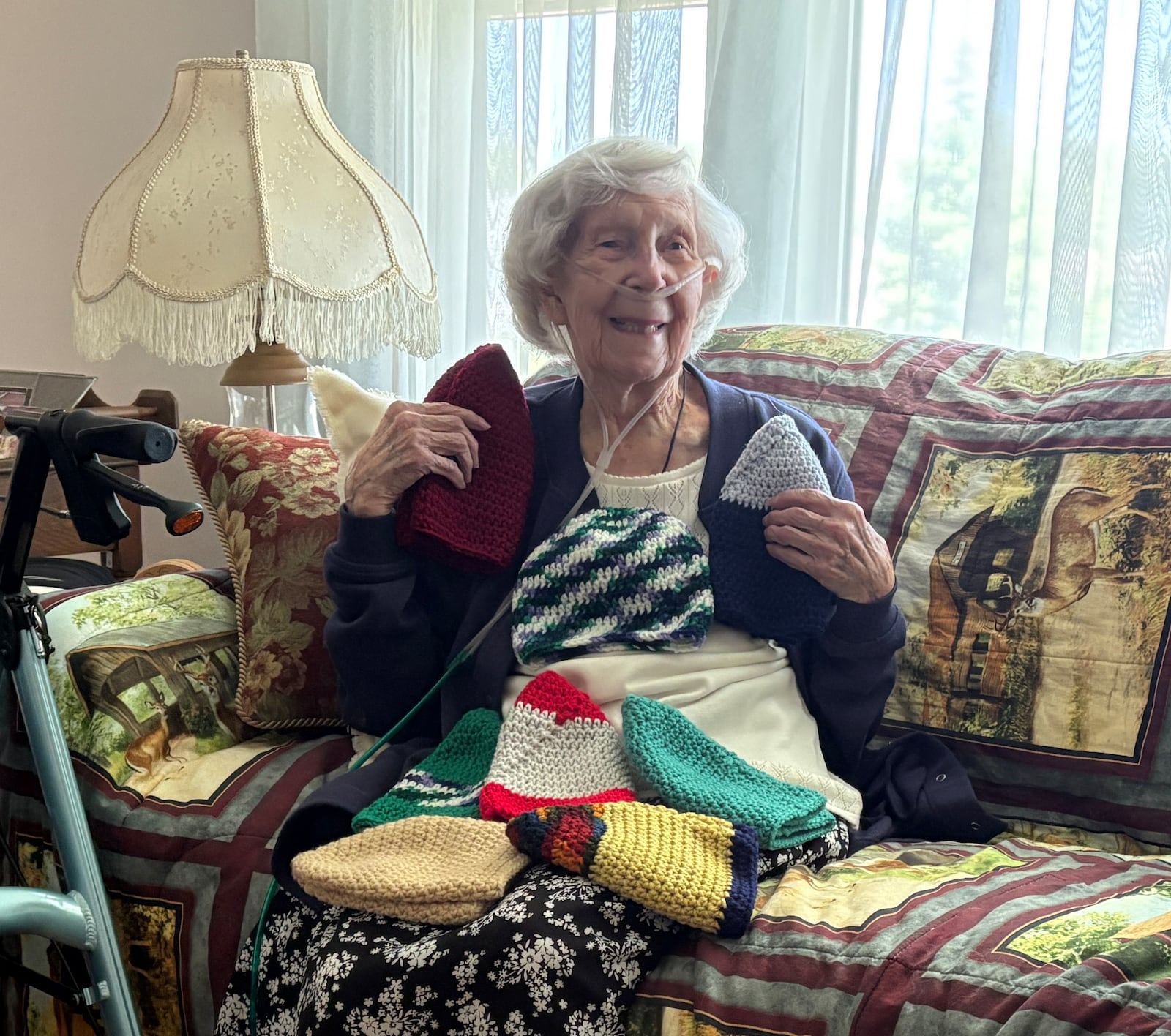 Kathy Moore at 100 crochets several dozen winter hats a year to donate to people in need. JEN BALDUF/STAFF