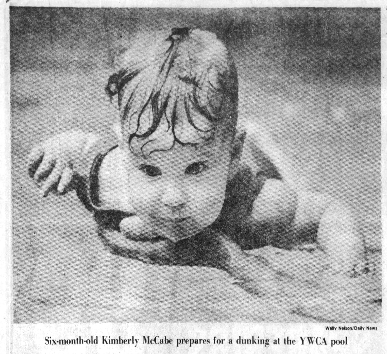 Six-month-old Kimberly McCabe prepares for a dunking at the YWCA pool in 1976. DAYTON DAILY NEWS ARCHIVES