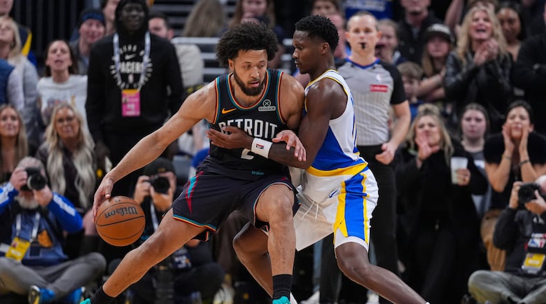 Detroit Pistons guard Cade Cunningham (2) drives on Indiana Pacers guard Bennedict Mathurin (00) during the second half of an NBA basketball game in Indianapolis, Monday, Nov. 24, 2025. (AP Photo/Michael Conroy)