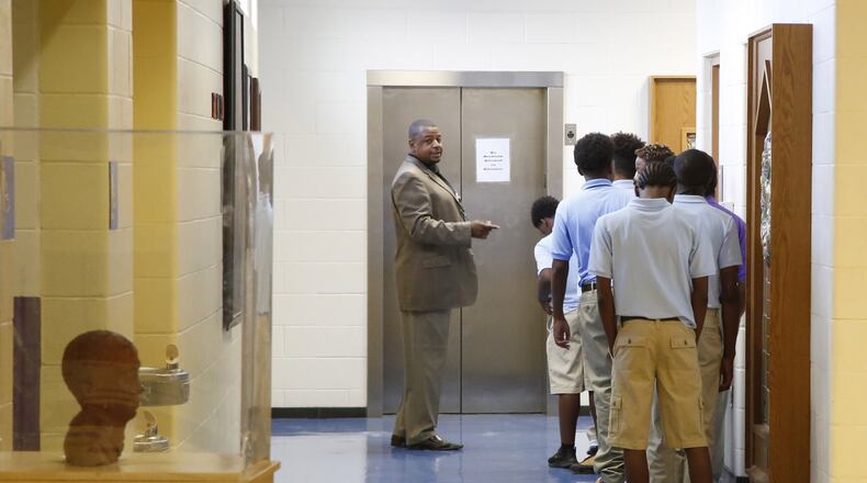 Dayton Boys Prep Academy students wait in line for a trip to the cafeteria on the first day of the 2018-2019 school year. TY GREENLEES / STAFF