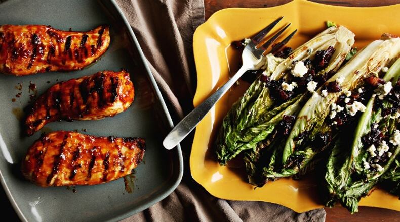 Grilled Glazed Boneless Chicken Breasts, left, and Grilled Romaine with Bacon-Blue Cheese Vinaigrette are great recipes for the summer grill. (Juli Leonard/Raleigh News & Observer/TNS)