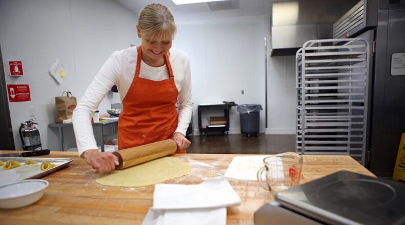 Baker Karen Hansen, owner of Copenhagen Pastry, rolls out the dough to make Napoleon hat cookies at her bakery on Dec. 7, 2015 in Pasadena, Calif. (Genaro Molina/Los Angeles Times/TNS)