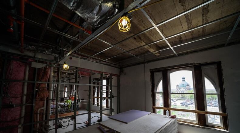 Drywall, insulation and bathtub/shower installation work on The Arts Lofts at The Dayton Arcade inside the Ludlow and Fourth Street buildings is now underway. CONTRIBUTED/TOM GILLIAM