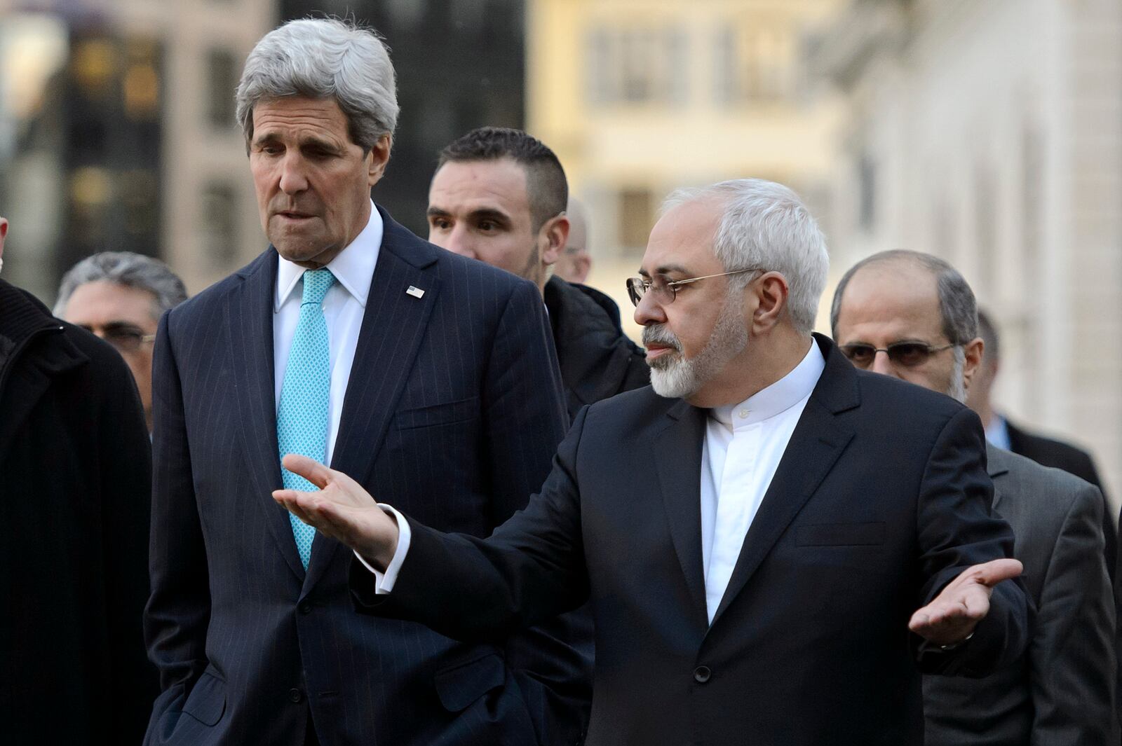 FILE - US Secretary of State John Kerry, left, listens to Iranian Foreign Minister Mohammad Javad Zarif, as they walk in the city of Geneva, Switzerland, Jan. 14, 2015, during a bilateral meeting ahead of the next round of nuclear discussions. (AP Photo/Keystone, Martial Trezzini, File)