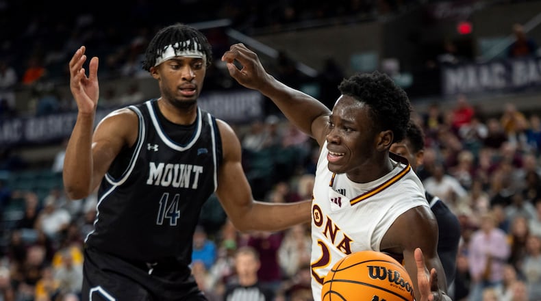 Iona's Adam Njie Jr., right, makes his move as Mount St. Mary's Jedy Cordilia, left, watches during the second half of an NCAA college basketball game in the championship of the Metro Atlantic Athletic Conference tournament, Saturday, March 15, 2025, in Atlantic City, N.J. (AP Photo/Chris Szagola)