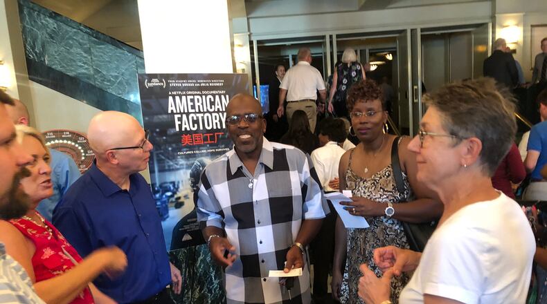 “American Factory”  from Oscar-nominated filmmakers Steve Bognar and Julia Reichert made its theatrical debut Monday, Aug. 19 at the Victoria Theatre in downtown Dayton.  Bognar and Reichert (blue and white shirts) are pictured with Louis Carter and Shawnea Rosser-Carter (center), Jill Lamantia and an unidentified man. Rosser-Carter and Lamantia were in American Factory. Louis Carter was in “Last Truck,” an 2009 movie from Bognar and Reichert that earned them an Oscar nomination.