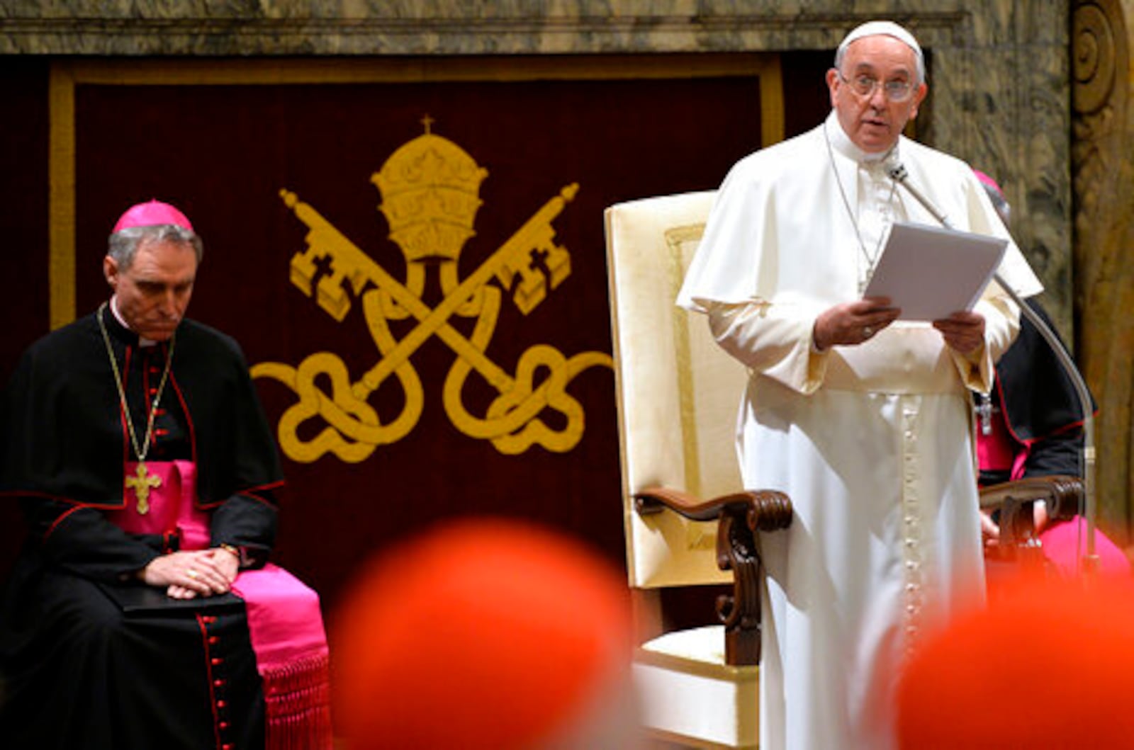 FILE - Pope Francis delivers his message during a meeting with Cardinals and Bishops of the Vatican Curia on the occasion of the exchange of Christmas greetings in the Clementine hall at Vatican, Monday, Dec. 22, 2014. (AP Photo/Andreas Solaro, Pool, File)