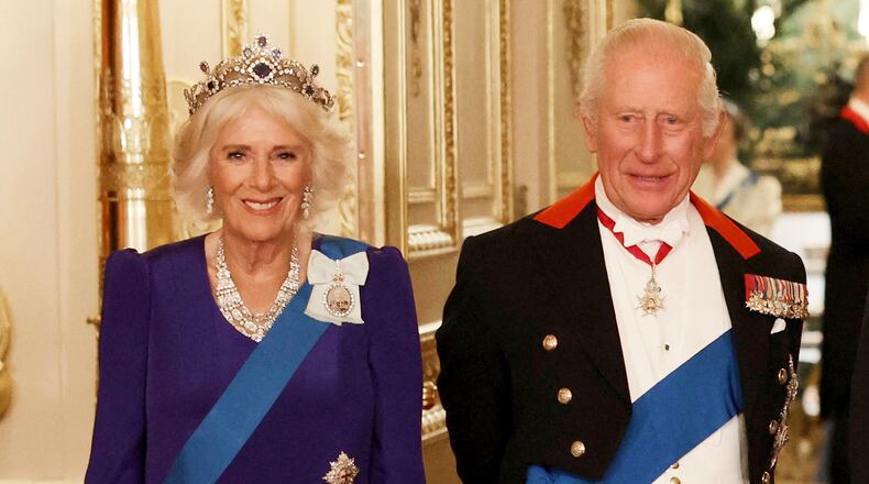 FILE - Britain's Queen Camilla, left, and King Charles III, right, pose for a photo before a State Banquet at Windsor Castle, in Windsor, England, Sept. 17, 2025. (Phil Noble/Pool Photo via AP, file)