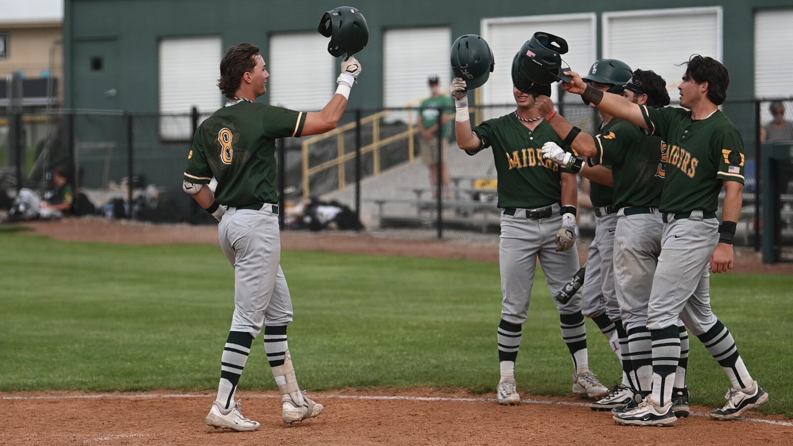Wright State University sophomore JP Peltier celebrates with teammates during their game on Friday, May 16 at Purdue Fort Wayne. The Raiders won 23-11. JORDAN WOMMACK / CONTRIBUTED PHOTO