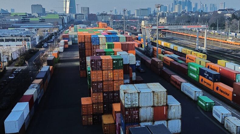 Containers are piled up at a cargo terminal in Frankfurt, Germany, Friday, Jan. 23, 2026. (AP Photo/Michael Probst)