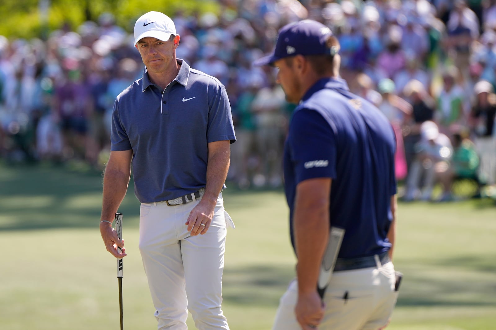 Rory McIlroy, of Northern Ireland, watches Bryson DeChambeau on the sixth hole during the final round at the Masters golf tournament, Sunday, April 13, 2025, in Augusta, Ga. (AP Photo/Julia Demaree Nikhinson)