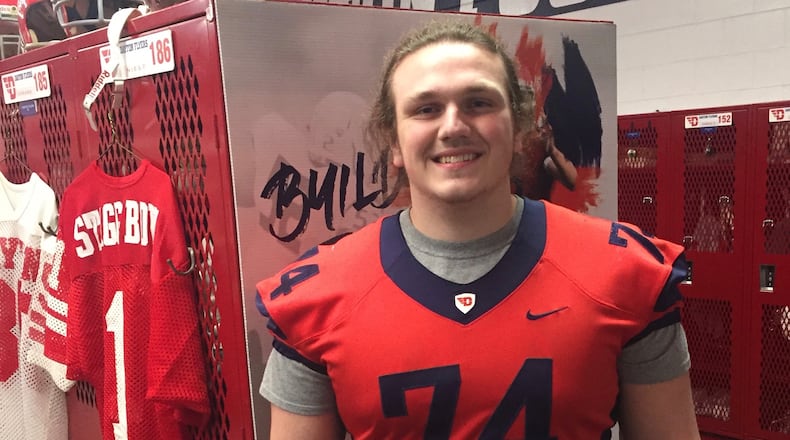 Alter offensive lineman Nathan Grey poses for a photo in the Dayton football locker room. Submitted photo