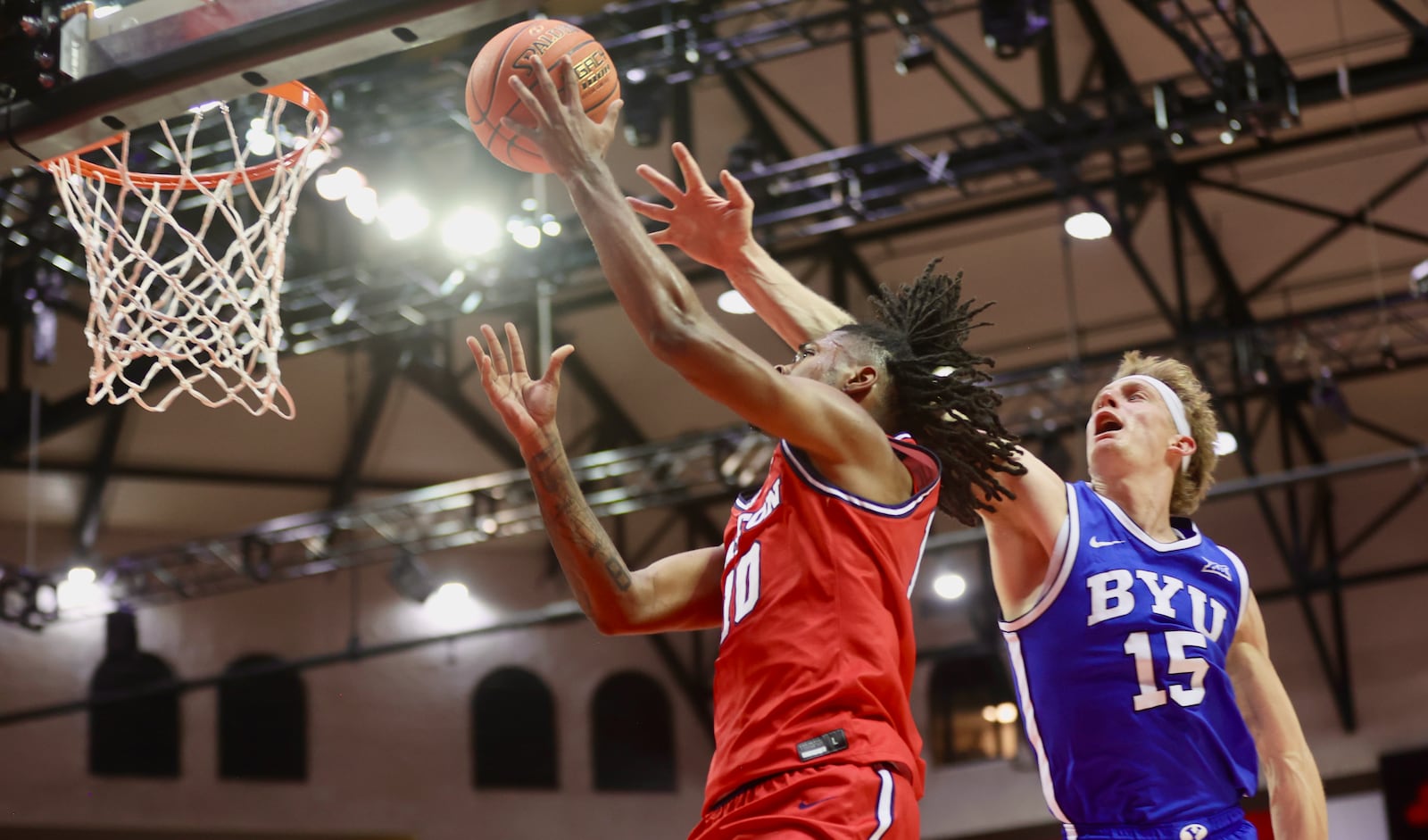 Dayton's Bryce Heard scores a game-tying basket with four minutes to play against Brigham Young on Friday, Nov. 28, 2025, at the State Farm Field House in Kissimmee, Fla. David Jablonski/Staff
