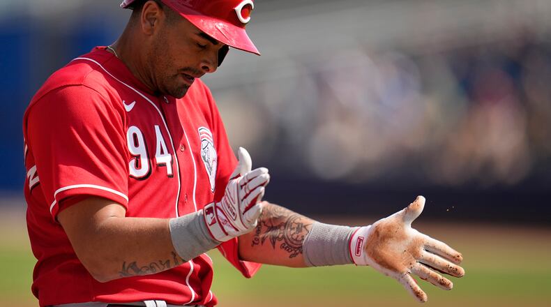 Cincinnati Reds' Christian Encarnacion-Strand celebrates after hitting a triple during the third inning of a spring training baseball game against the San Diego Padres, Wednesday, March 8, 2023, in Peoria, Ariz. (AP Photo/Abbie Parr)