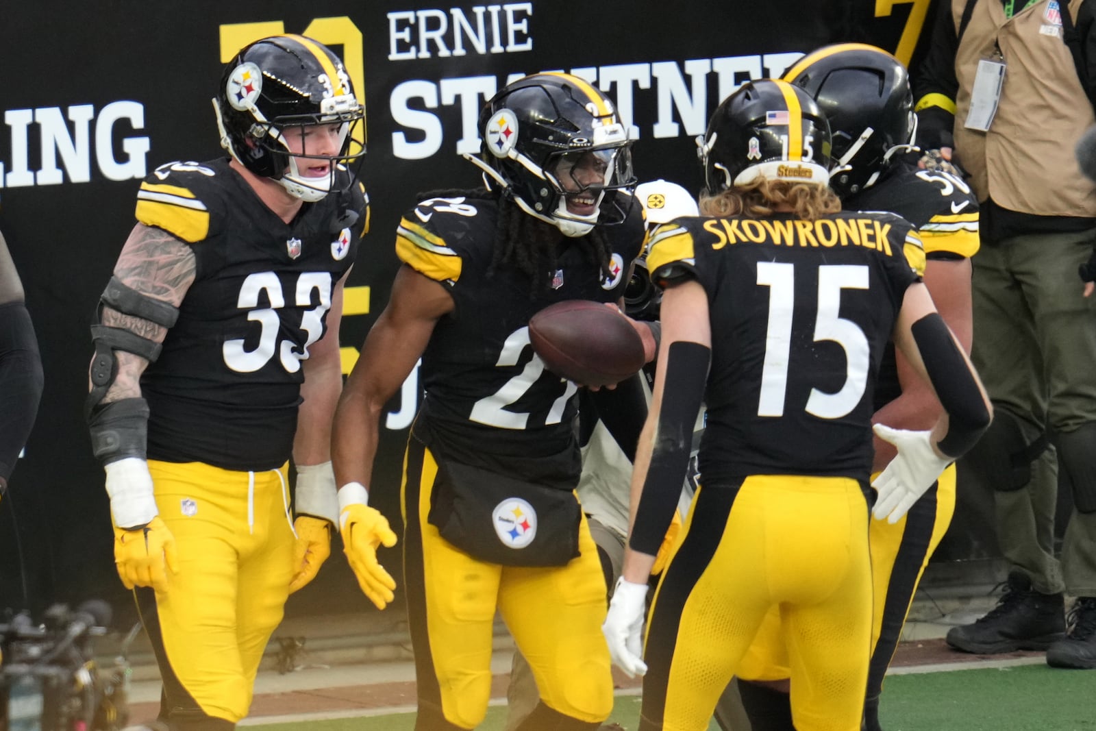 Pittsburgh Steelers safety Kyle Dugger, center, celebrates after scoring a touchdown against the Cincinnati Bengals during the second half of an NFL football game Sunday, Nov. 16, 2025, in Pittsburgh. (AP Photo/Gene J. Puskar)