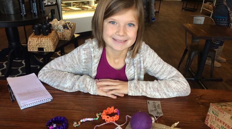 Nine-year-old Lauren Pollock made and sold bracelets and ornaments to raise $200 for the Clark County Humane Society on Dec. 28. KATE PATRICK/STAFF