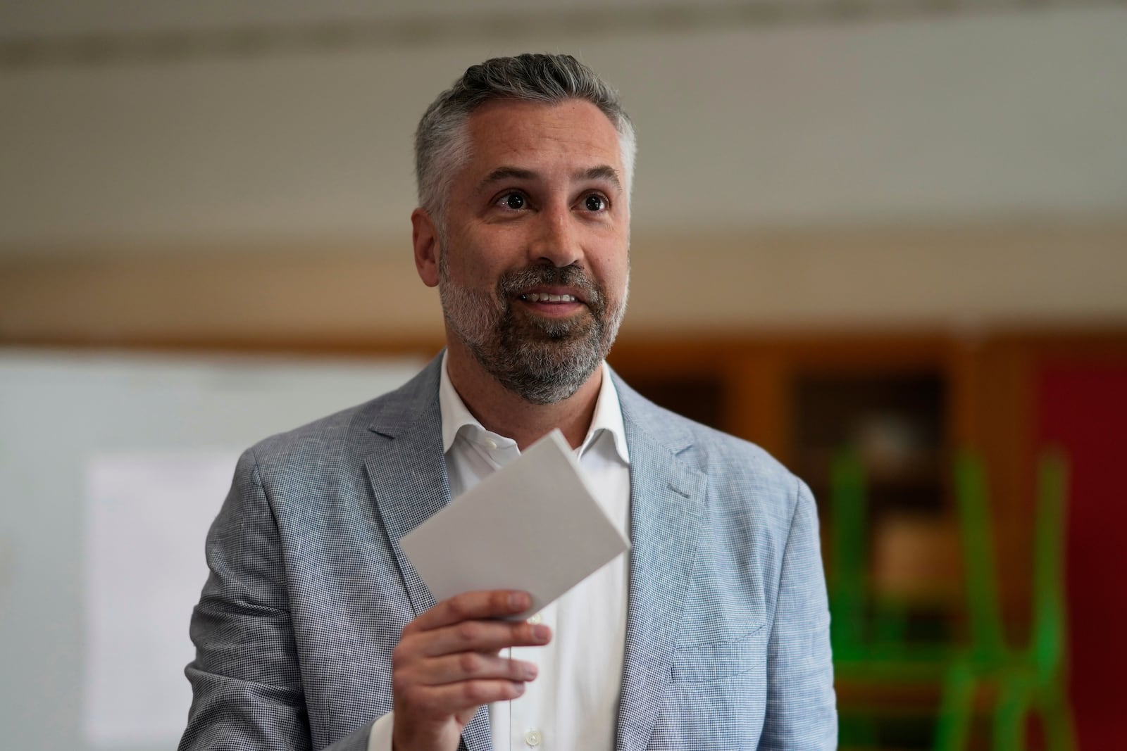 Socialist Party secretary general Pedro Nuno Santos holds his ballot when voting in Portugal's general election at a polling station in Lisbon, Sunday, May 18, 2025. (AP Photo/Armando Franca)