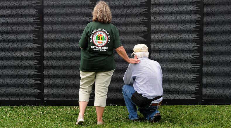 Visitors at the Wall That Heals Thursday, July 27, 2023, at Yankee Park in Centerville. The Wall That Heals is a traveling exhibit honoring the more than three million Americans who served in the U.S. armed forces in the Vietnam War. It bears the names of the 58,281 men and women who made the ultimate sacrifice in Vietnam. Washington-Centerville Public Library was awarded the honor of hosting the Vietnam Veterans Memorial Fund exhibit. It will remain open 24 hours until a closing ceremony at 1:45 p.m. Sunday, July 30. MARSHALL GORBY\STAFF