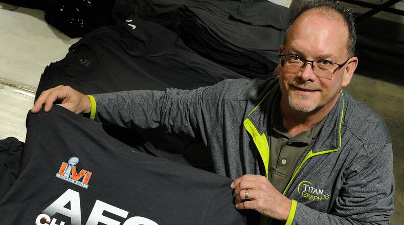 Bob Thomas, VP Operation for Titan Graphics on Needmore Rd, displays the Cincinnati Bengals AFC Championship t-shirt that the business printed for the NFL. MARSHALL GORBY\STAFF