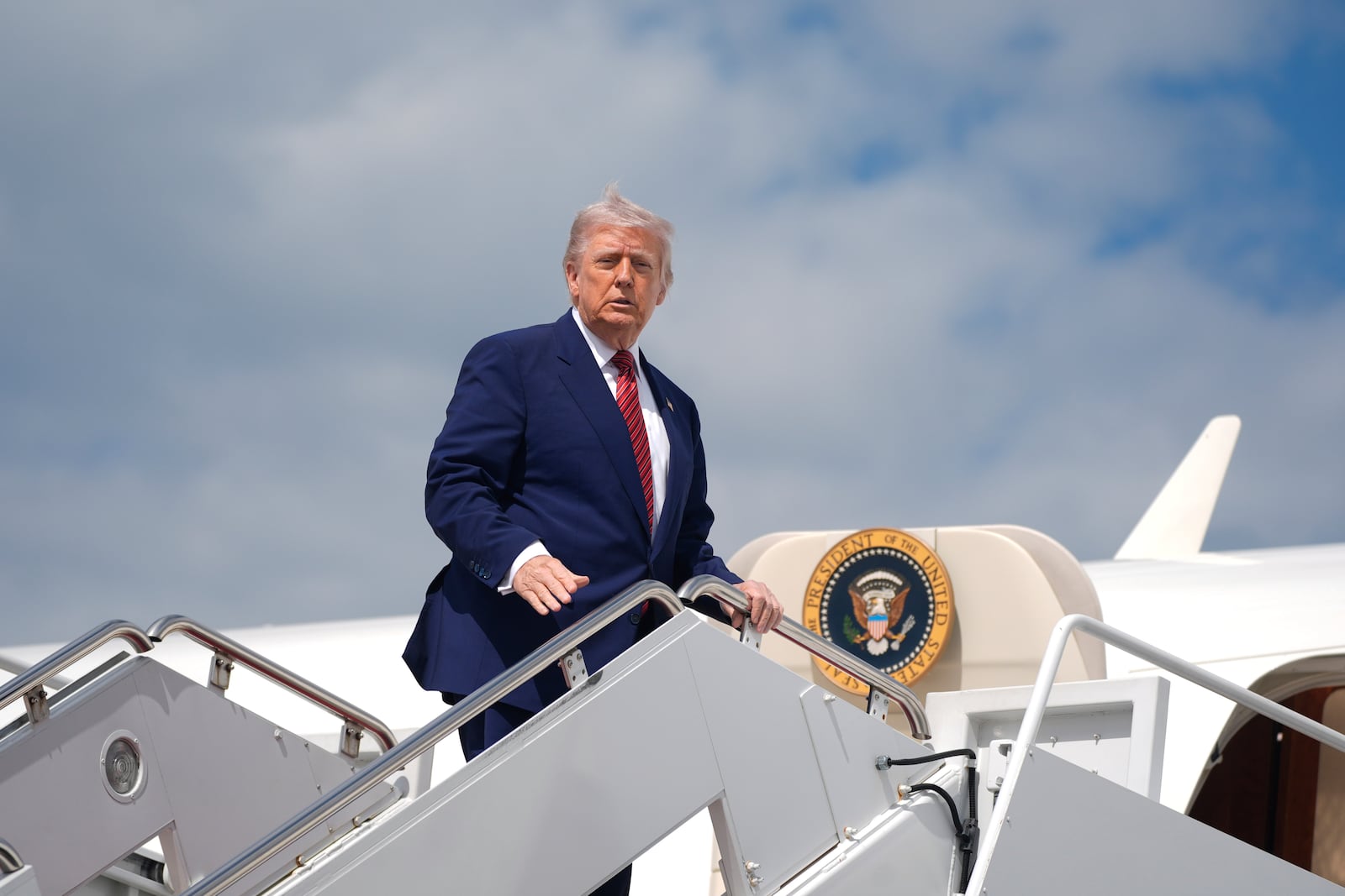 President Donald Trump boards Air Force One to depart Joint Base Andrews, Md., Friday, May 23, 2025. (AP Photo/Manuel Balce Ceneta)