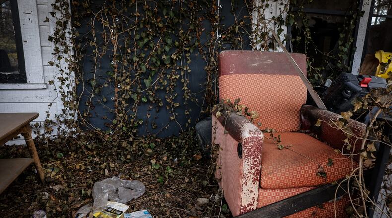 An empty porch and chair are left in the 500 block of Lexington Ave. in Dayton. JIM NOELKER/STAFF